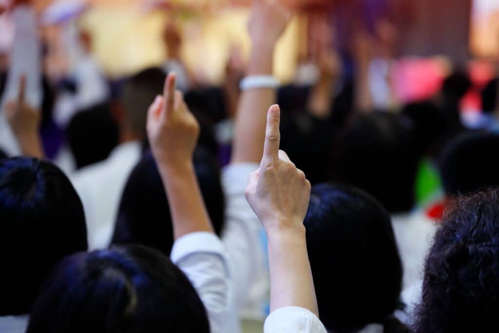people with their hands up improving their small improvements in your process can dramatically boost your bid success rate